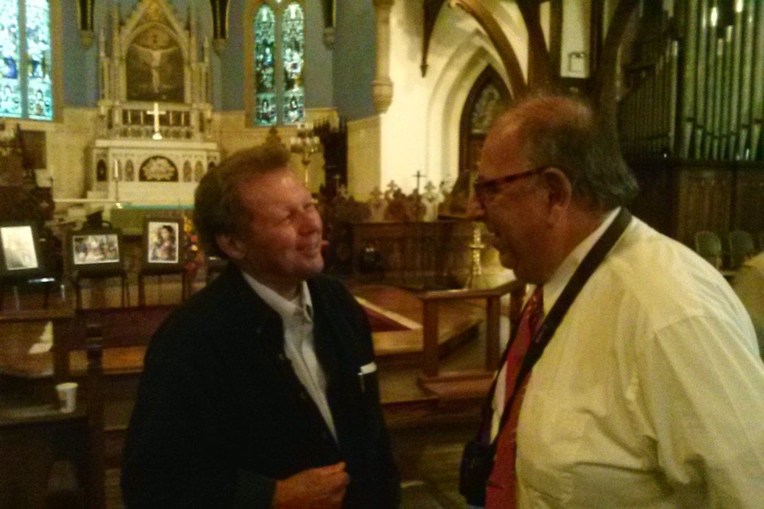 Father Roy Bourgeois speaks with a participant photographer in Photography for Social Justice, a program started by Cabrini professor Linda...