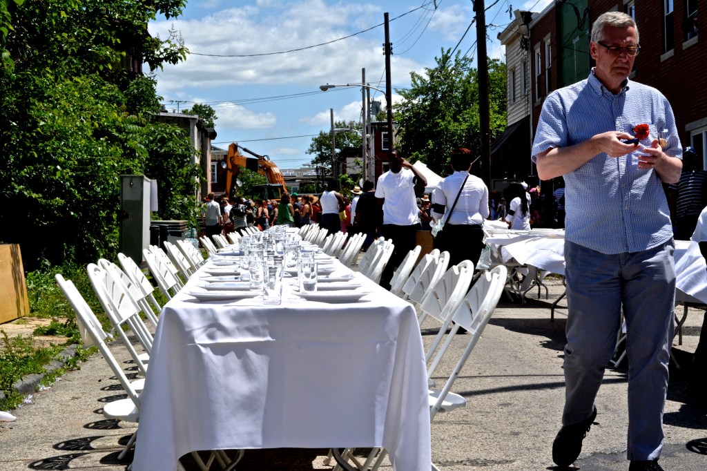 The community prepares for dinner after the funeral. Photo by Joshua Albert