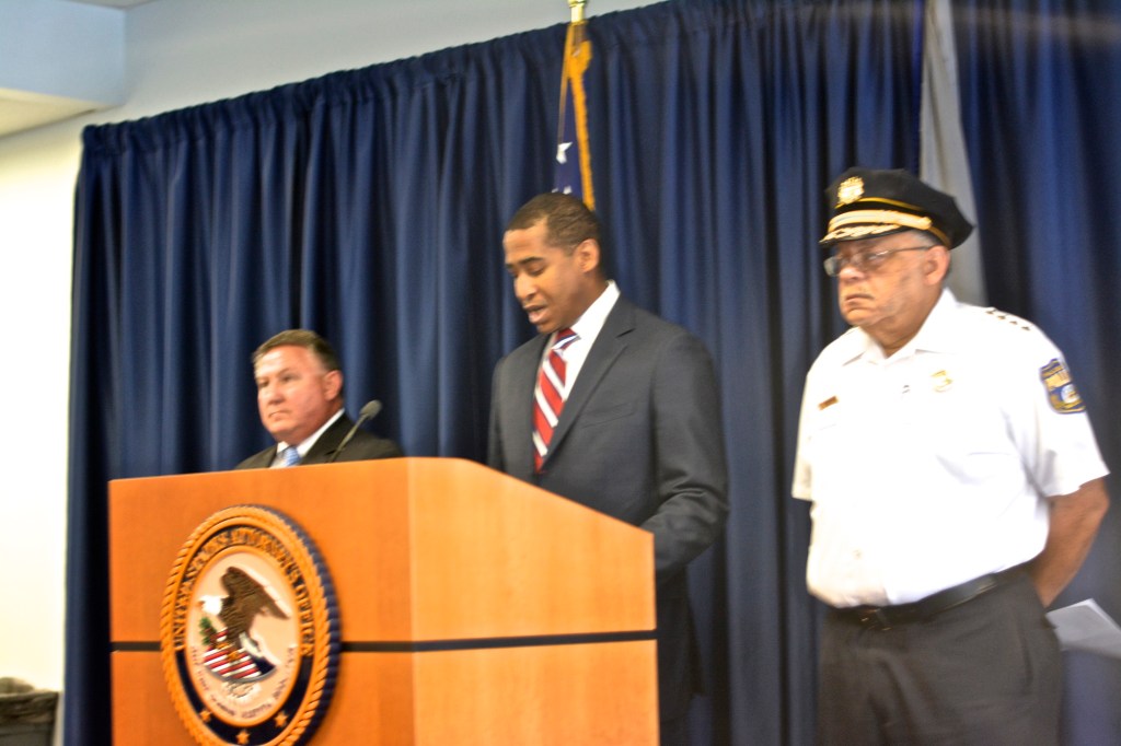 Assistant US Attorney Anthony Wzorek announces charges against Philadelphia narcotics officers. (Right: Police Commissioner Charles Ramsey; Left: FBI Special Agent-in-Charge Edward Hanko. Photo: Joshua Albert
