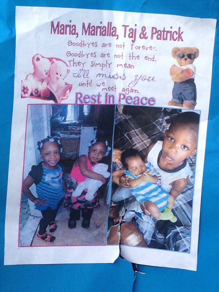 A memorial erected at the site of the fire July 5 on Gesner Street, which killed four people. Photo by Joshua Albert