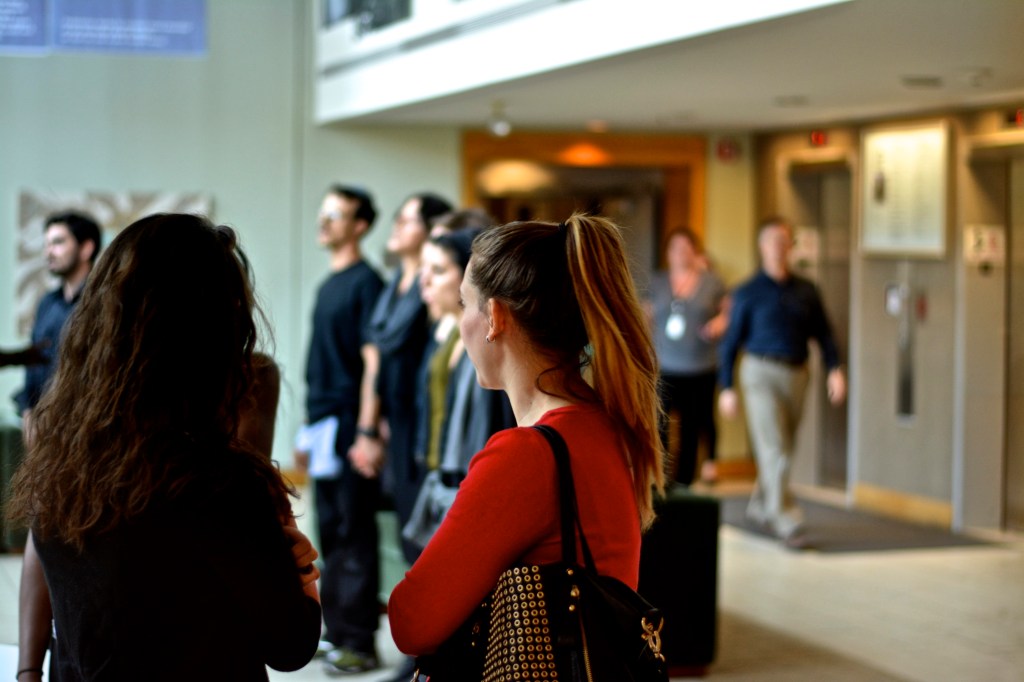 Building employees pause to watch the six protesters. (Photo: Joshua Albert)