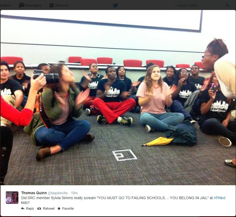 Commissioner Simms yelling at children during last night's sit-in. Photo via Raging Chicken Press