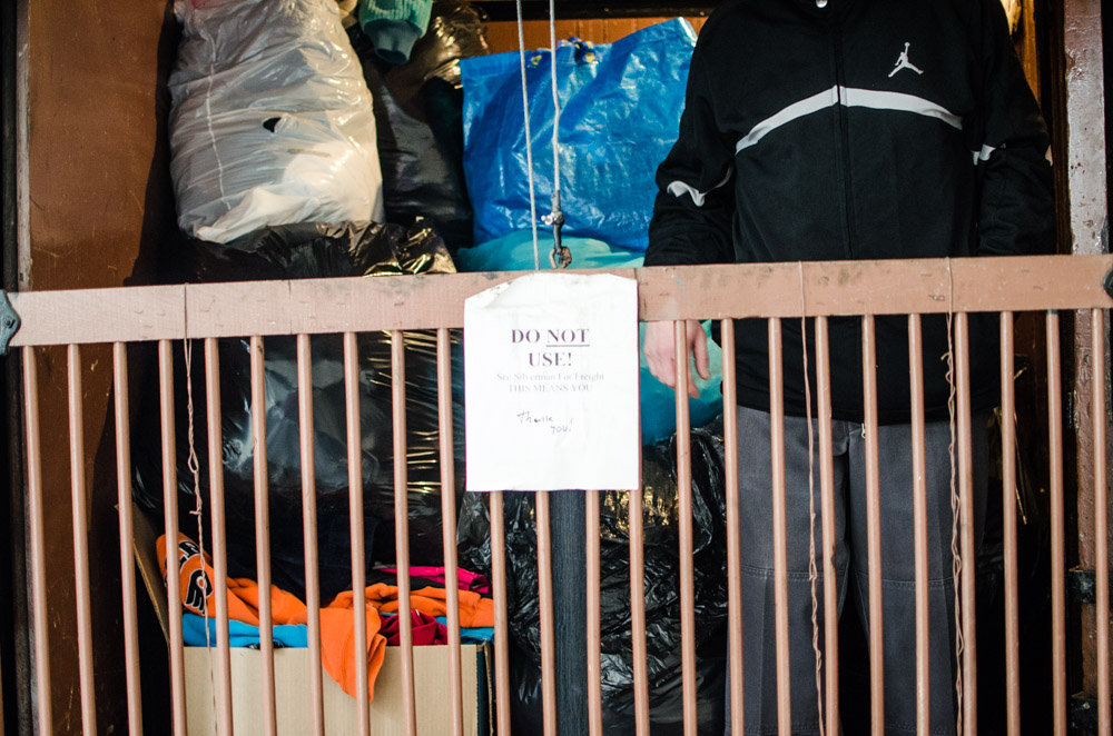 Donated clothes are loaded in elevator to be distributed to various charities.  Photo by Joshua Albert