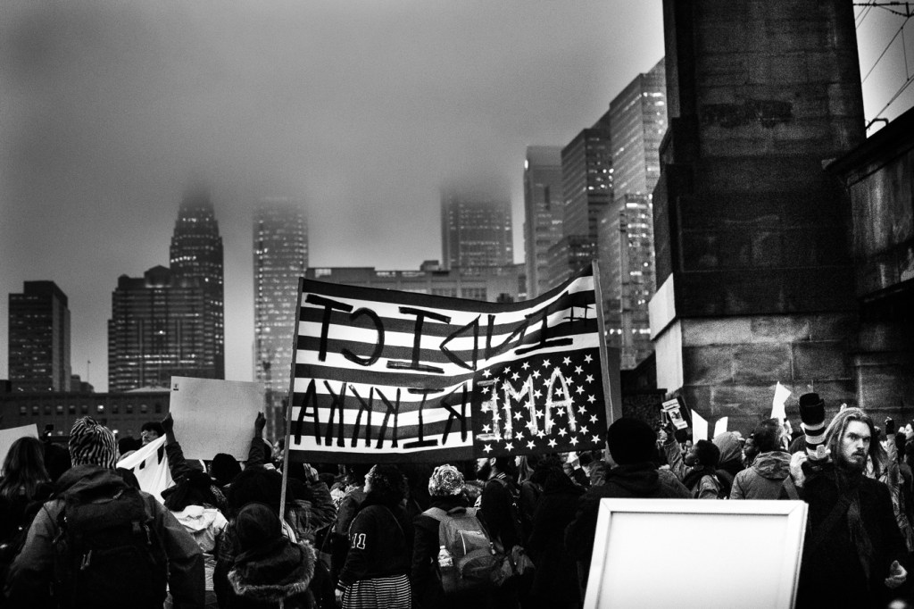 Demonstrators march down Market Street towards City Hall. Photo: Joshua Albert