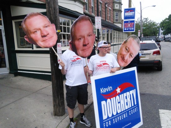 IBEW 98 members with Kevin Dougherty and Jim Kenney heads outside of the Famous 4th Street Deli this morning. Photo by Kenneth Lipp